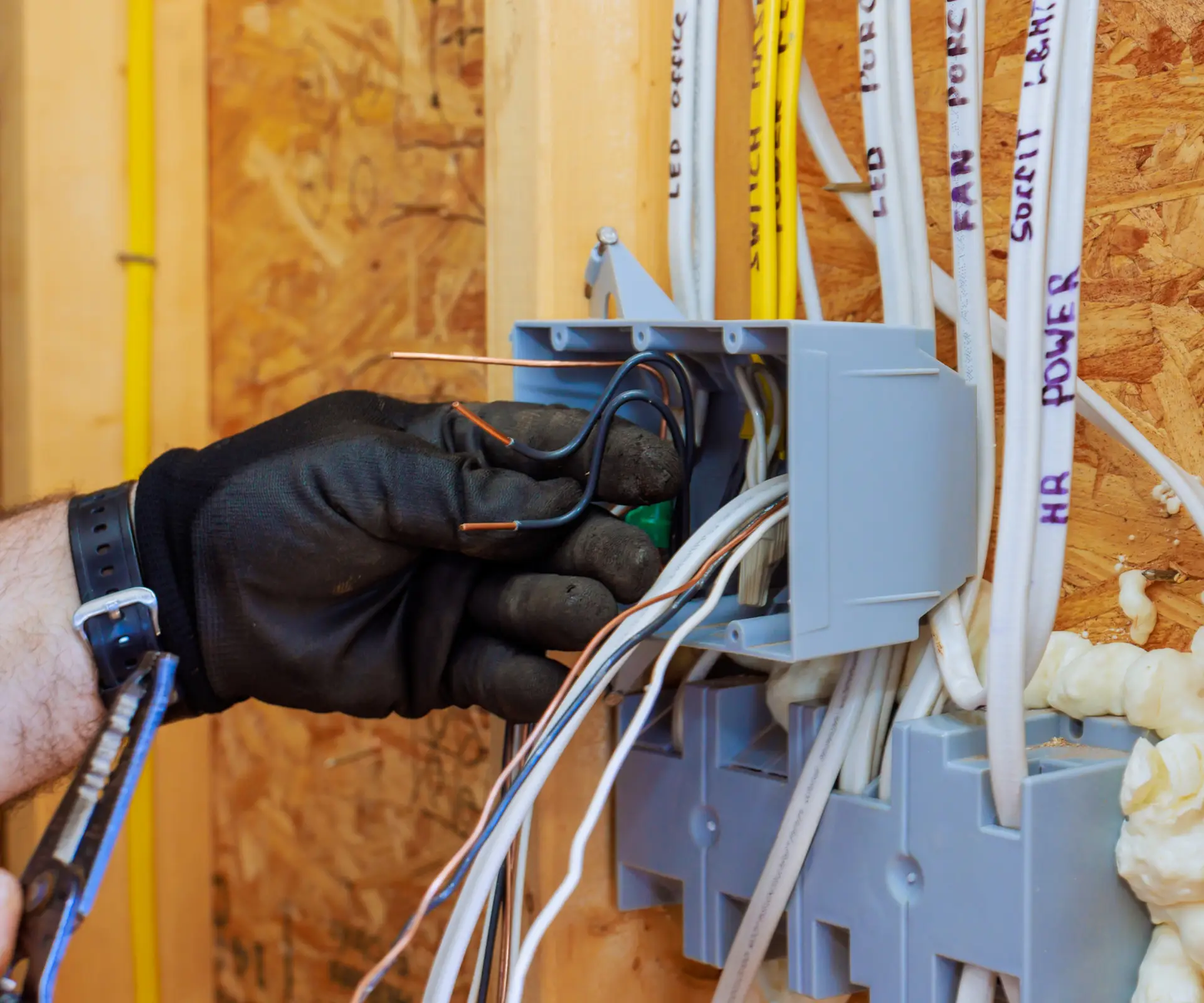 Electrician working on wiring installation